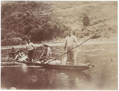 UNKNOWN PHOTOGRAPHER WHANGANUI Māori in a dugout canoe with dog, Whanganui River