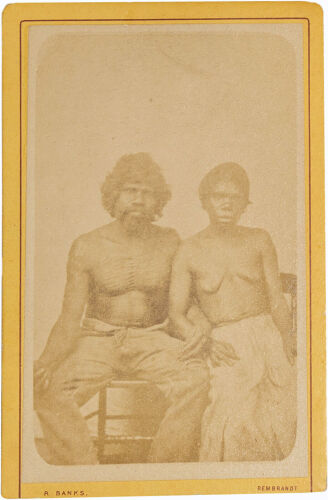 ALFRED WREN, MELBOURNE Aboriginal man and woman sitting with linked arms, man has chest lines