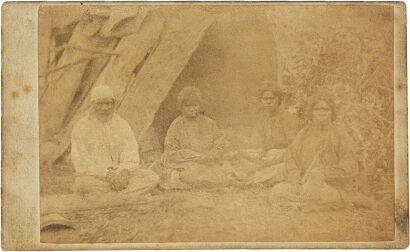 UNKNOWN PHOTOGRAPHER Aborigines in bark shelter camp