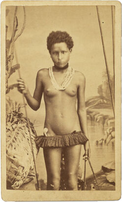 ALLAN HUGHAN, NOUMEA Portrait of the daughter of Kanak Chief Waton, pipe tucked in skirt, wearing a necklace made of braided hair strings with magical value and necklaces of pearls and shells