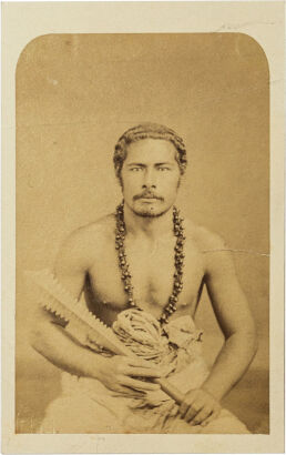 UNKNOWN PHOTOGRAPHER Samoan man holding carved paddle headed club