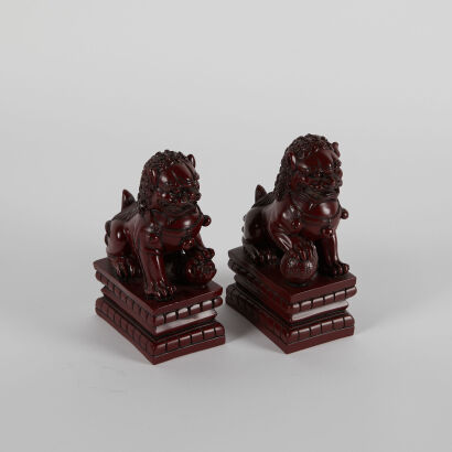 A Pair of Carved Chinese Resin Lions