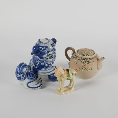 A Chinese Blue and White Figure of Lion (chipped), A Sancai-Glazed Figure of Horse & A Teapot