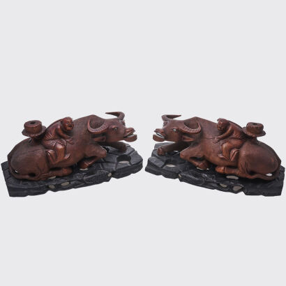 A Pair of Late 19th to Early 20th Century Chinese Wood Carved 'Boy and Buffalo' Figurines