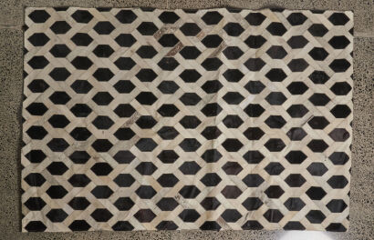 A Cow Hide and Leather Rug