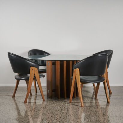 A Modernest Glass Top Table With Four Chairs