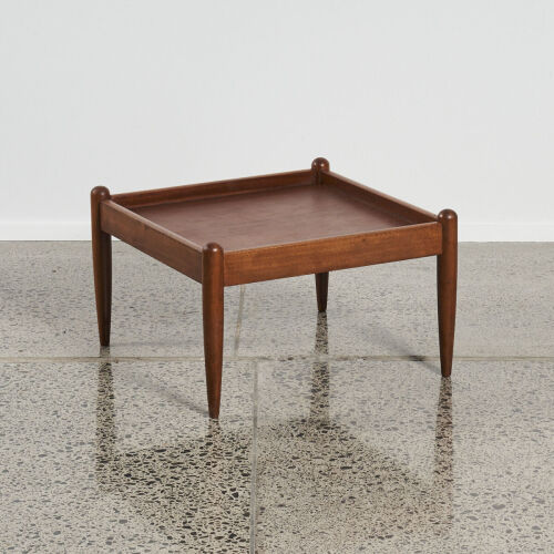 A Mid-Century Teak Coffee Table With Tapered Legs