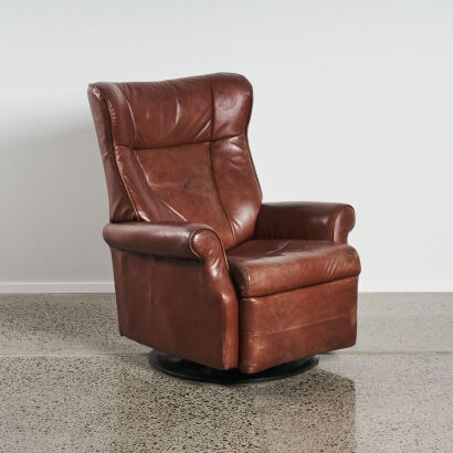 A Leather Recling and Swivel Based Armchair