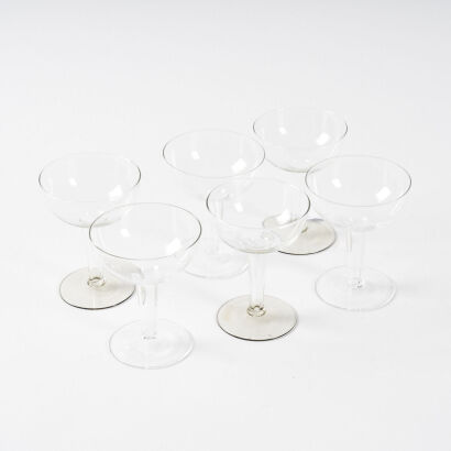 A Set Of Six Hollow Stem Champagne Glasses