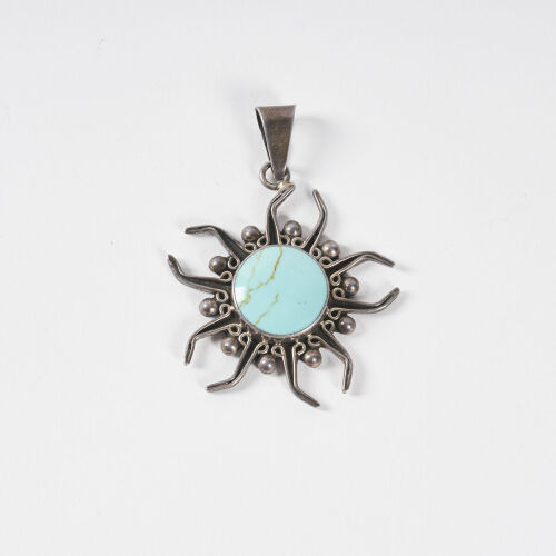 A Mid-Century Turquoise and Silver Pendant