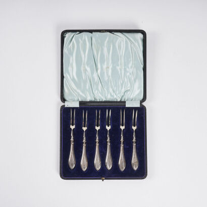 A Boxed Set Of English Silver Oyster Forks