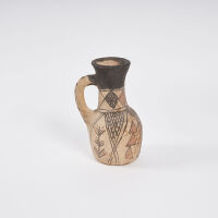 A Low Fired Earthenware Jug