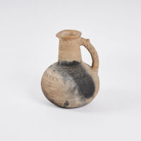 A Low Fired Earthenware Jug