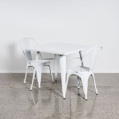 A Tolix Style Table With Two Chairs