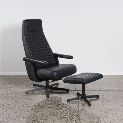 A Contemporary Black Recliner With Foot Stool
