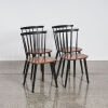 A Set of Four Scandinavian Spindle Back Dining Chairs
