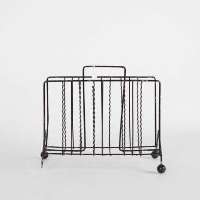 A Vintage Atomic Style Magazine Rack