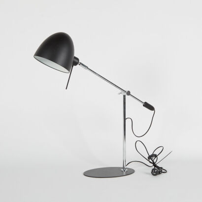 A Contemporary Adjustable Desktop Lamp In Black and Chrome