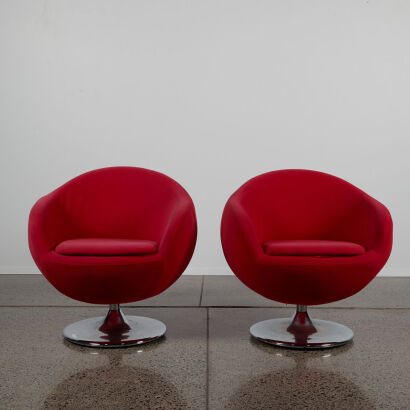 A Pair Off Tub Chairs With A Swivel Base