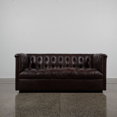 A Mid-Century Brown Leather Button Backed Couch