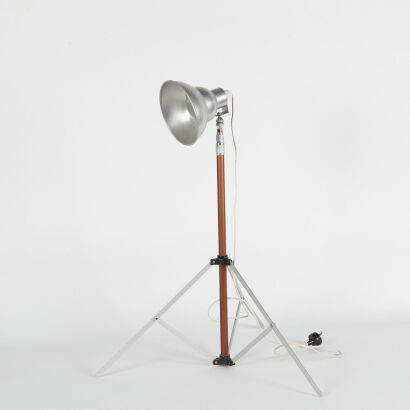 An Industrial Folding Tripod Floor Lamp