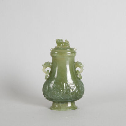 A Carved Chinese Qing-Dynasty Jade Two-Handled Lidded Vase