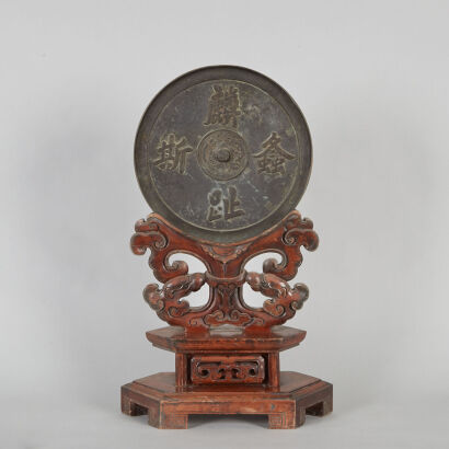 A Chinese Bronze Mirror with original carved stand