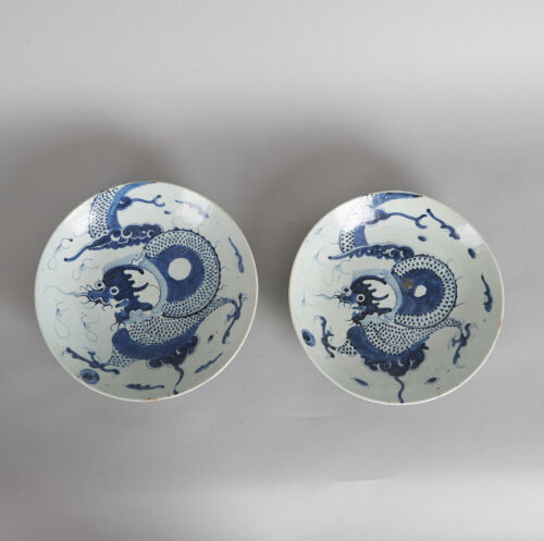 A Pair of Late Ming/ Early Qing-Dynasty Blue and White 'Dragon' Dishes (one repaired)