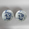 A Pair of Late Ming/ Early Qing-Dynasty Blue and White 'Dragon' Dishes (one repaired)