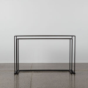 A Pair Of Black Metal Nesting Console Tables