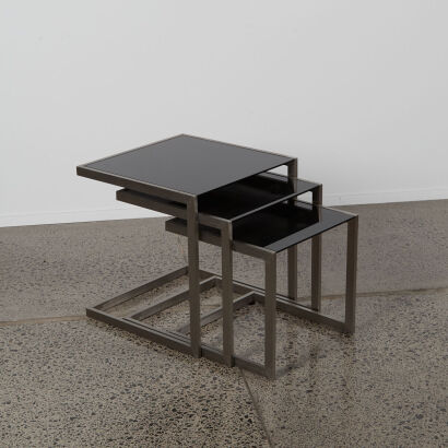 A Contemporary Nest Of Three Black Glass Coffee Tables