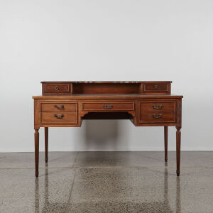 A Leather Topped Antique Writing Desk With Tapered Legs