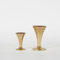 A set Of Two Brass Pillar Candle Sticks