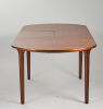 A Nathan Furniture Extendable Teak Oval Dining Table - 4