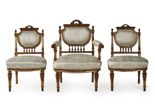 A French Louis XVI Style Walnut and Giltwood Seven-Piece Salon Suite