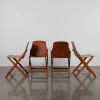 A Set Of Four Storkline Folding Chairs