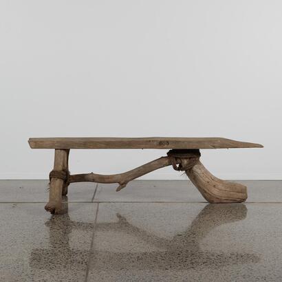 A Rustic Three-Legged Beach Seat