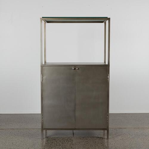 An Industrial Metal Cabinet With Glass Shelving