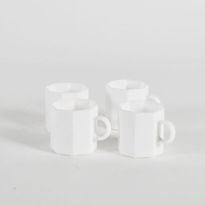 A Set Of Four White Retro Hexagonal Coffee Cups
