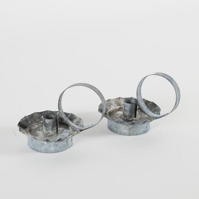 A Pair Of Tin Candle Holders