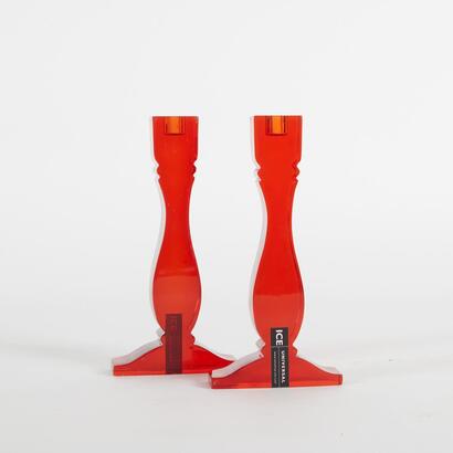 A Pair Of Red Lucite Candle Sticks