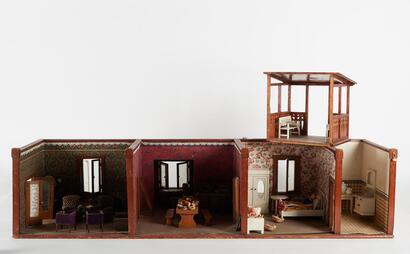 A Doll House and Large Assortment of Dolls Accessories