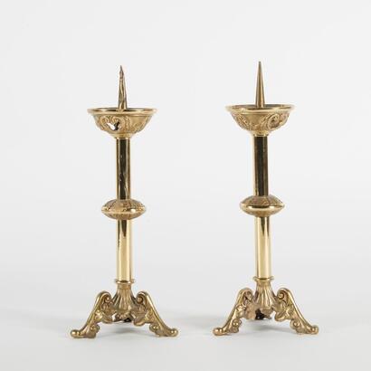 A Pair Of Brass Ecclesiastical Candle Sticks