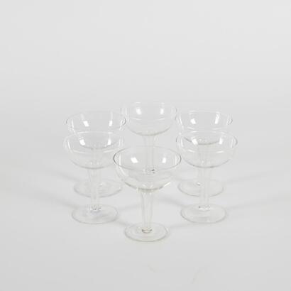 A Set Of Six Hollow Stem Champagne Glasses