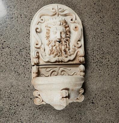 A Concrete Garden Wall Fountain Sculpture