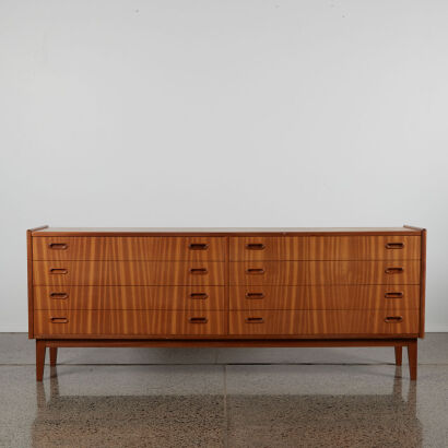 A Mid Century Teak Veneer Set Of Drawers With Eight Drawers