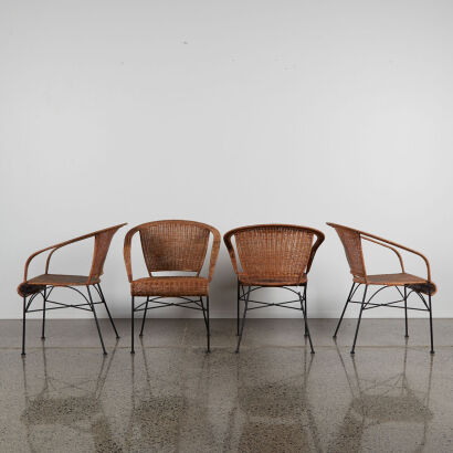 A Set Of Four Wicker Chairs With Metal Frames