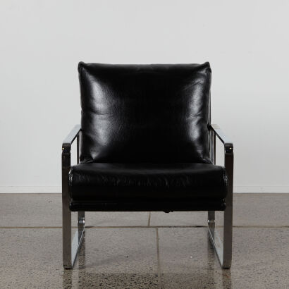 A Single Linear Lounge Chair With A Stainless Steel Frame