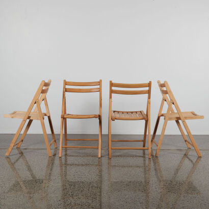 A Set Of Four Fold Down Timber Chairs