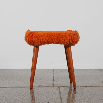 A Retro Stool With A Flurry Orange Top